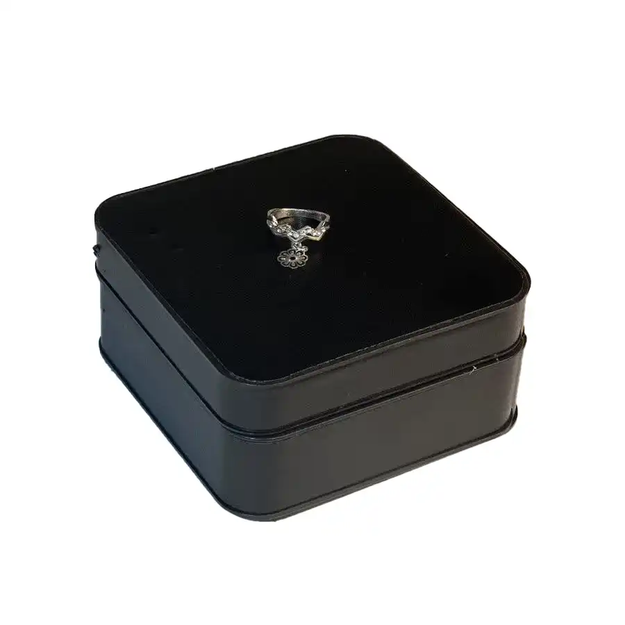 Flower pendant style knuckle ring